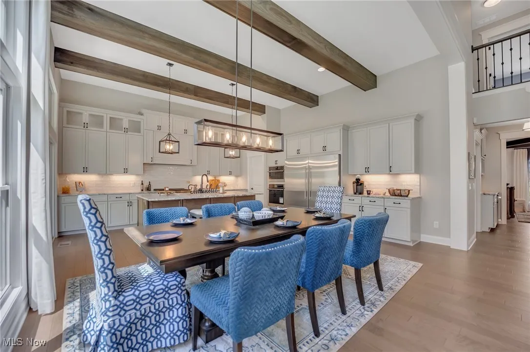 Kitchen Dinette area with hardwood flooring and beamed ceiling