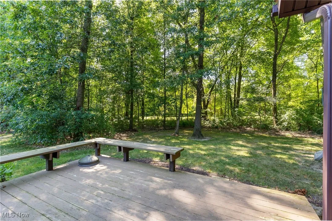 Wooden deck featuring a​​‌​​​​‌​​‌‌​‌‌​​​‌‌​‌​‌​‌​​​‌​​ lawn