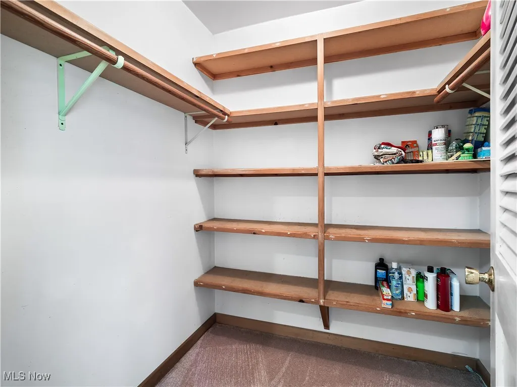 Walk in closet in primary bedroom