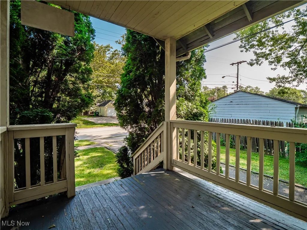 Private front porch with a lawn