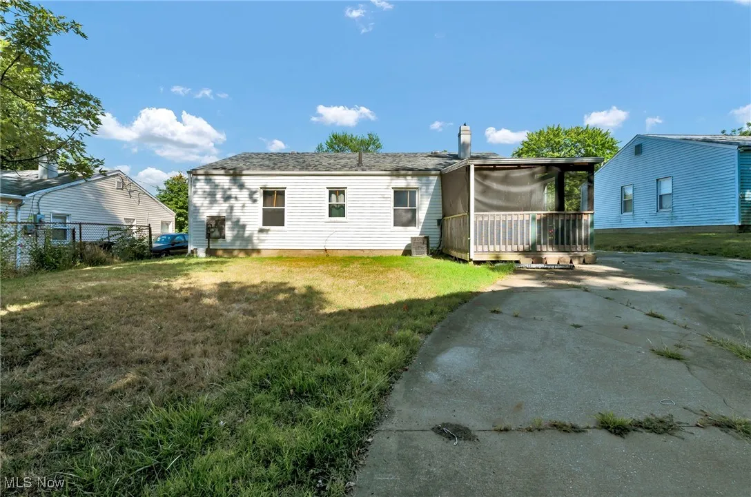 Rear view of property with a wooden deck