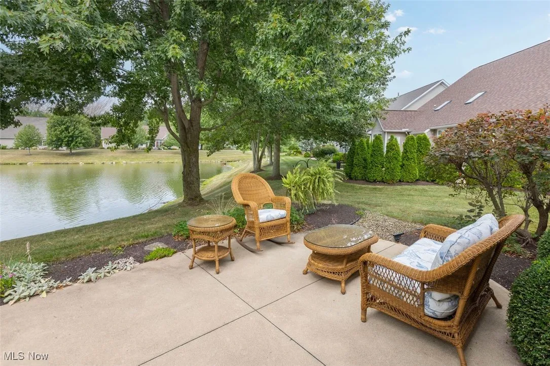 View of patio with a water view