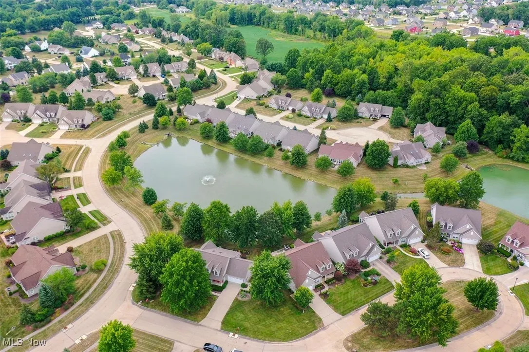 Aerial perspective of subdivision with a nearby pond