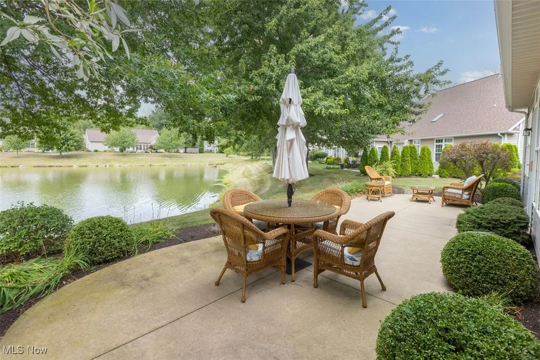 View of patio featuring a water view and dining area