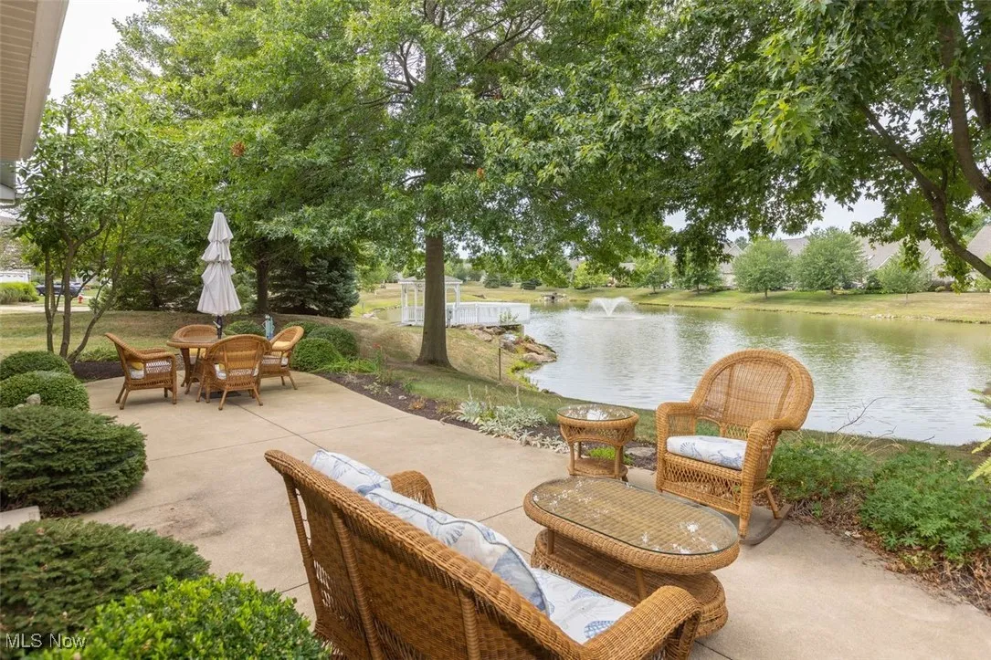 View of patio / terrace with a water view