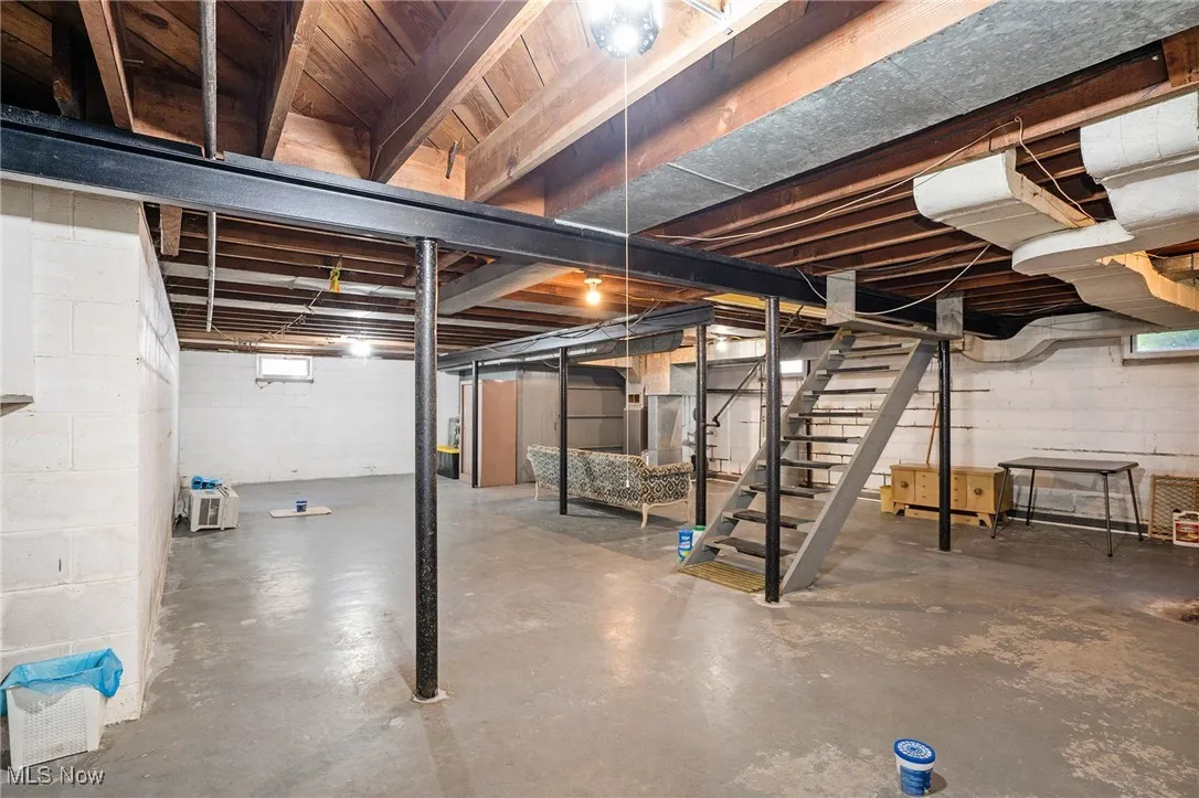 Basement featuring stairway
