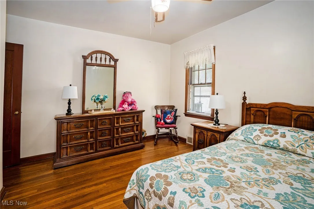 Bedroom featuring dark wood finished floors and ceiling fan