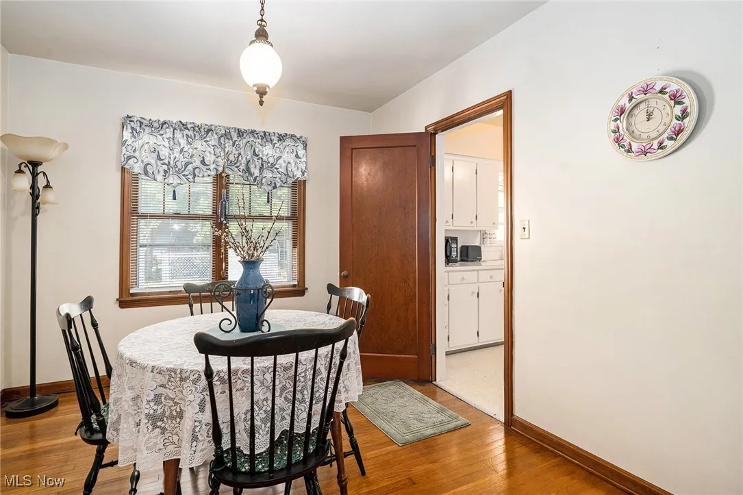 Dining area featuring light wood finished floors and baseboards