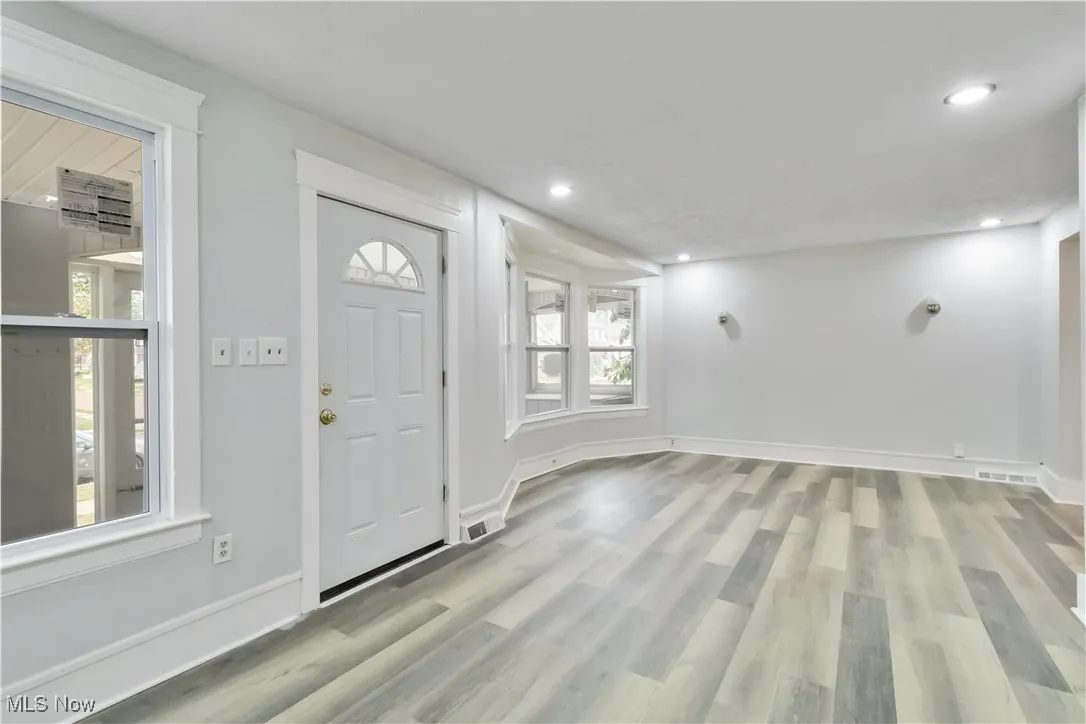 Entryway featuring light wood-type flooring and recessed lighting