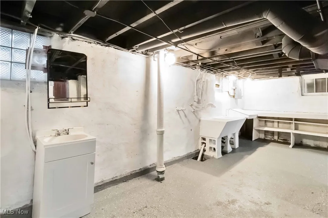 Basement featuring a sink