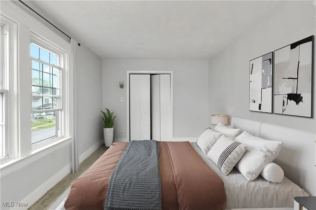 Bedroom featuring a closet and carpet floors