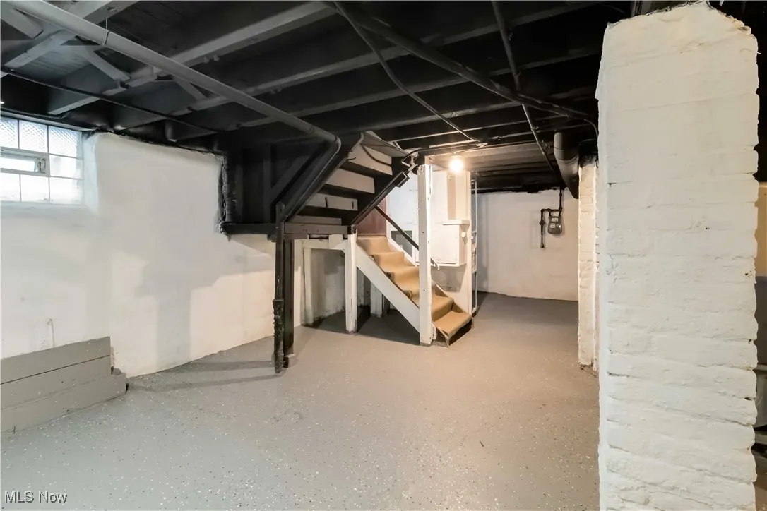 Basement featuring stairs