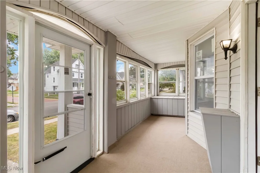Unfurnished sunroom with a residential view