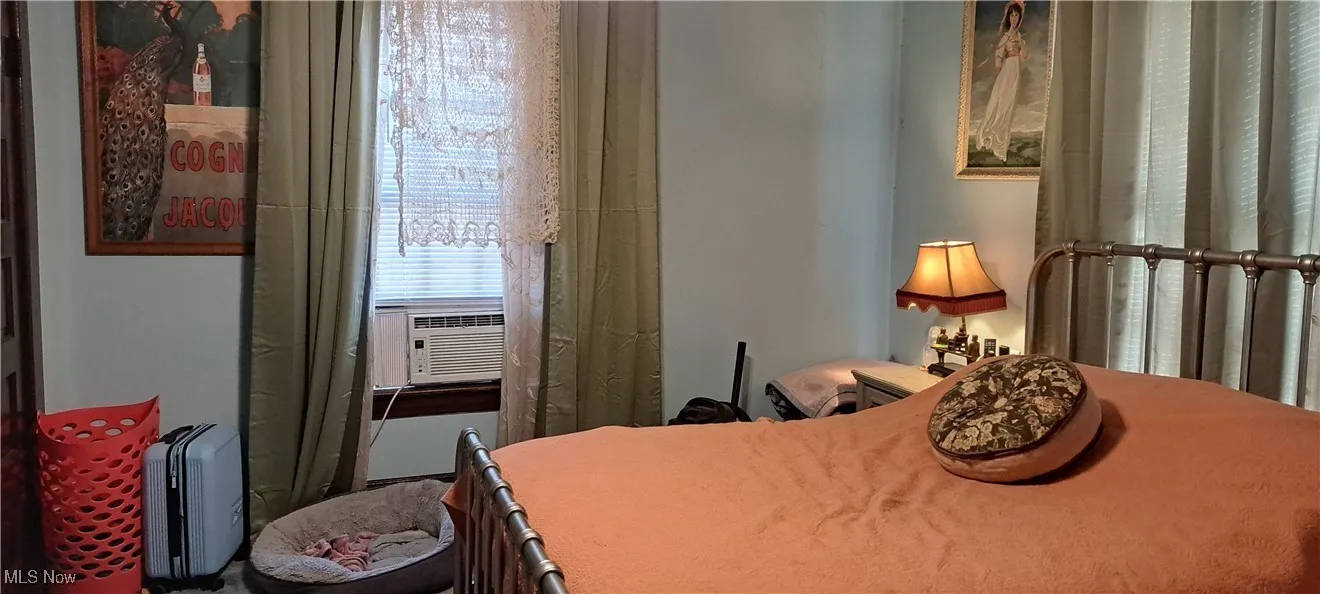 Bedroom featuring cooling unit