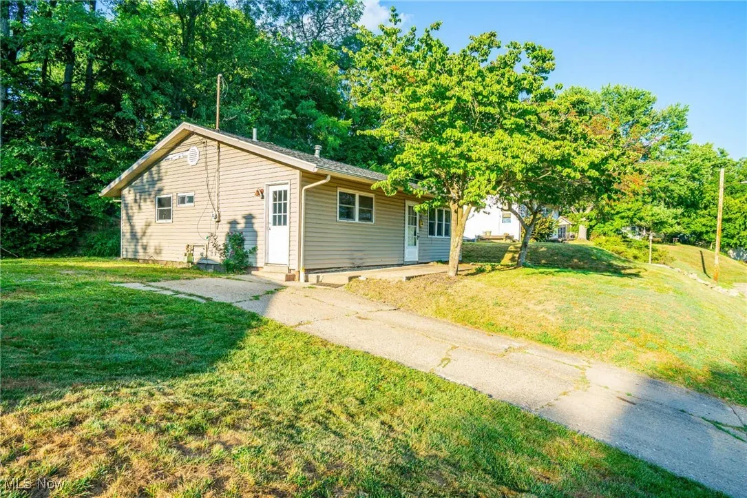 View of front of house featuring a front lawn