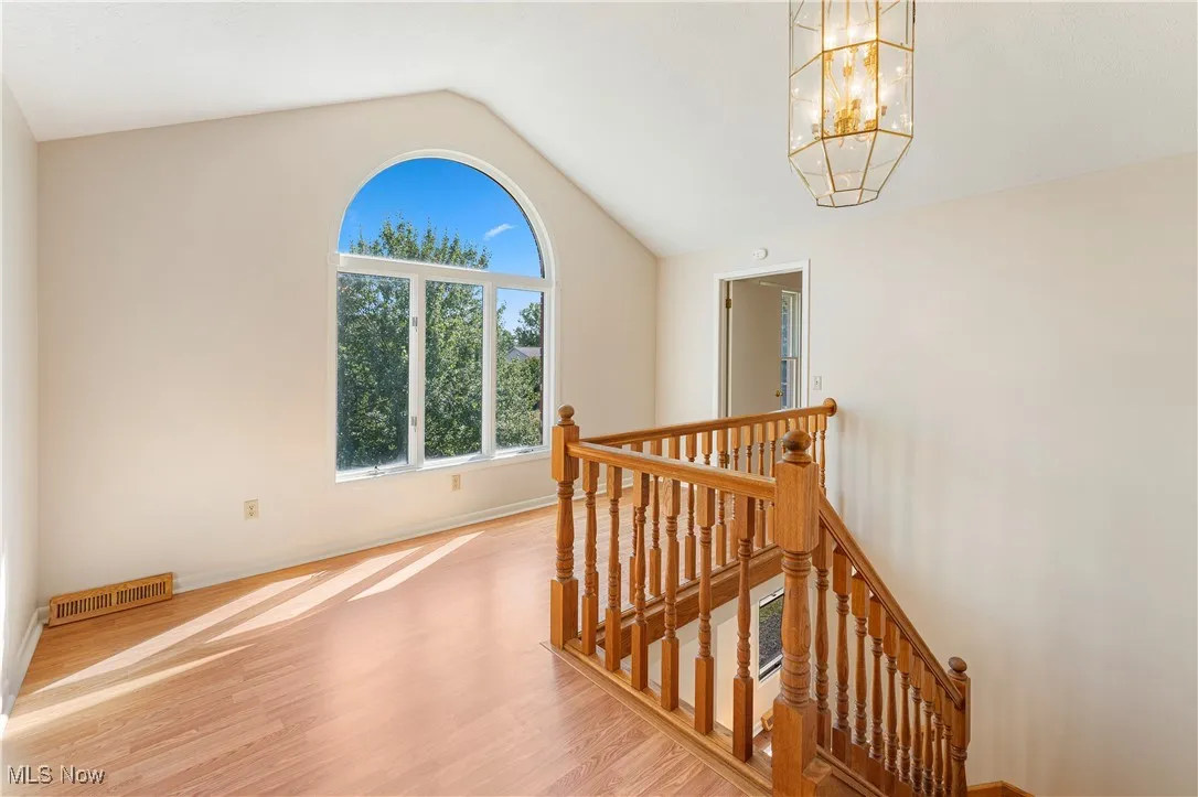 Upstairs foyer area could be office with a chandelier