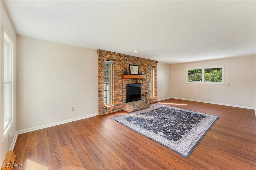 Living room with a fireplace and LVP
