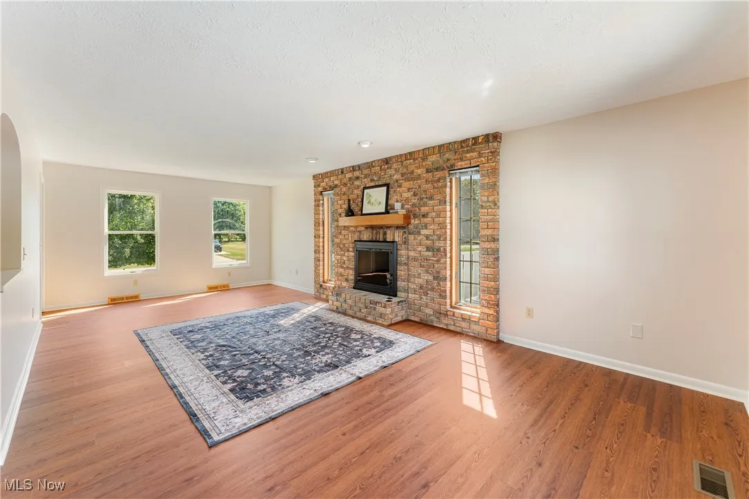 Unfurnished living room with a fireplace, LVP