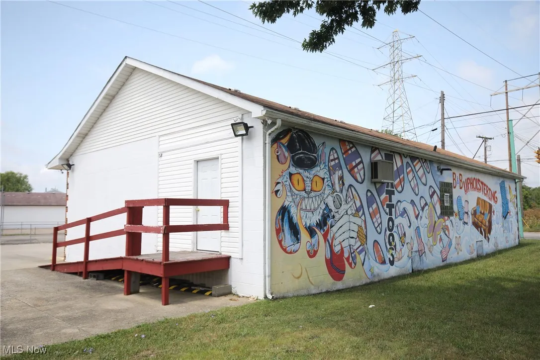 View of property exterior featuring a yard
