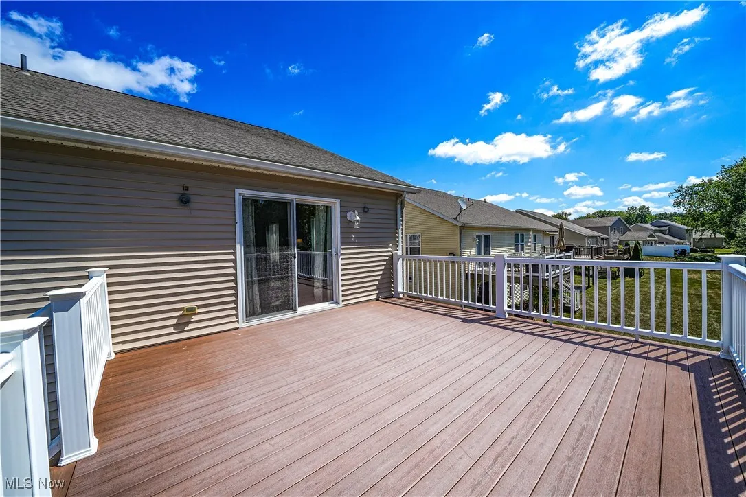Wooden terrace featuring a residential view