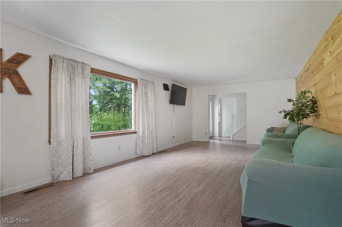 Living area featuring wood finished floors and baseboards