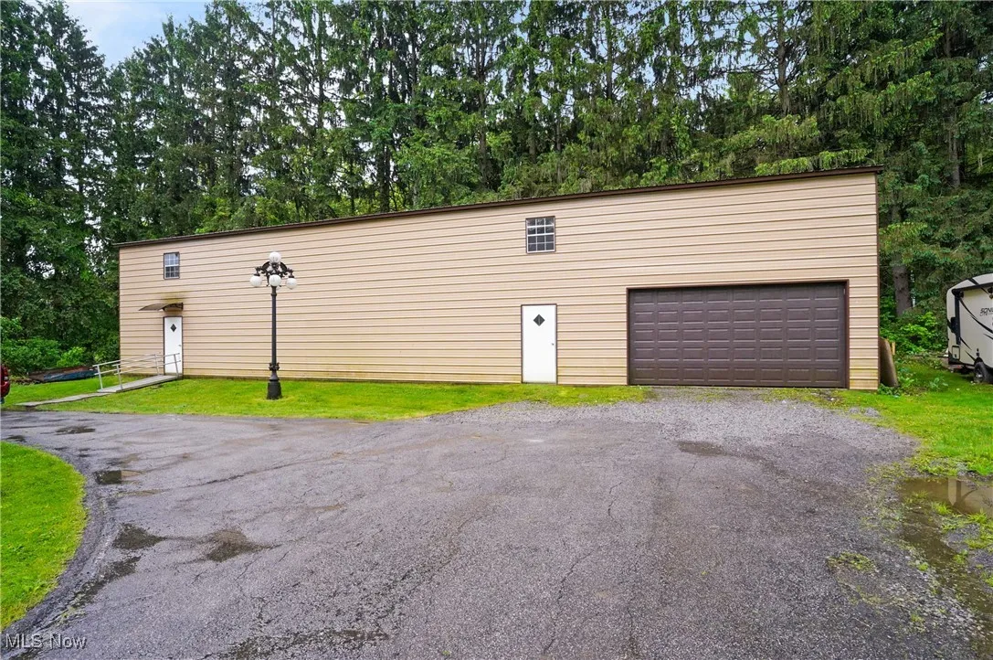 Garage featuring driveway