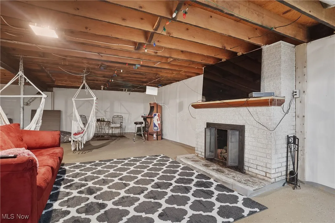 Unfinished basement with a fireplace