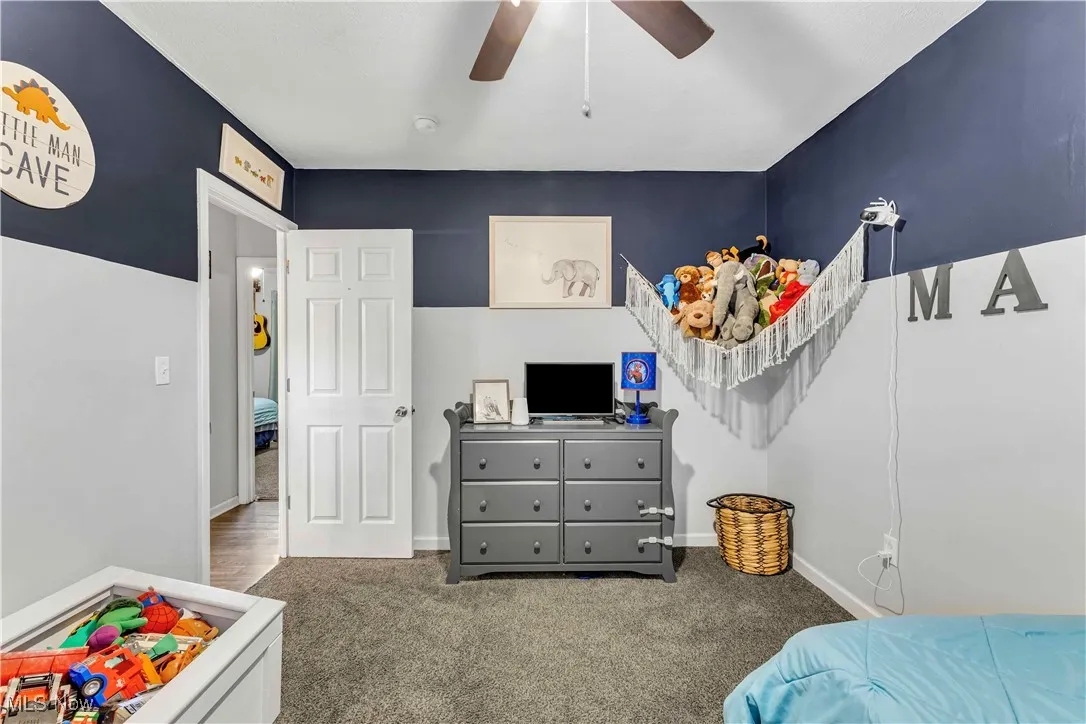 Bedroom featuring carpet floors, a ceiling fan, and a closet