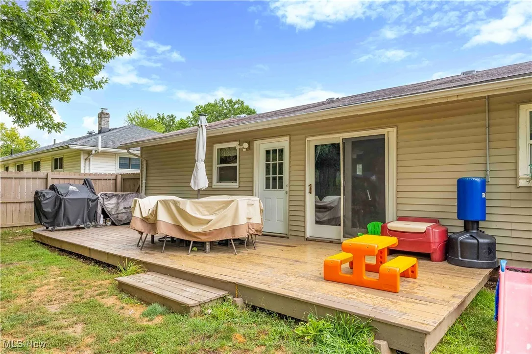Back of house featuring a wooden deck