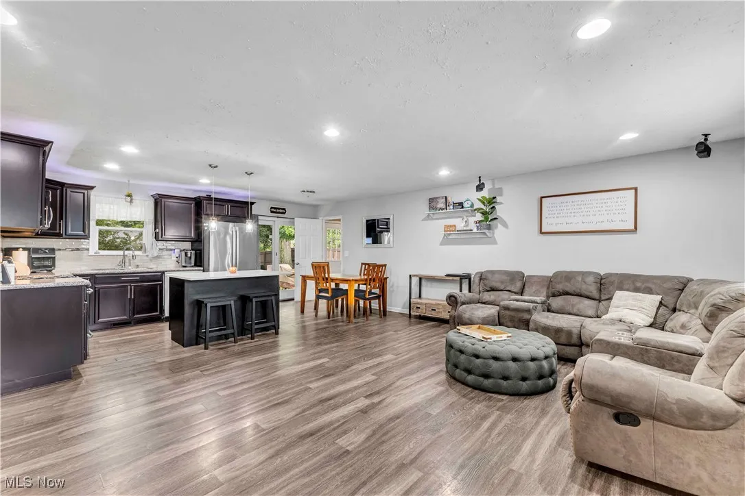 Living area featuring recessed lighting and light wood-style flooring