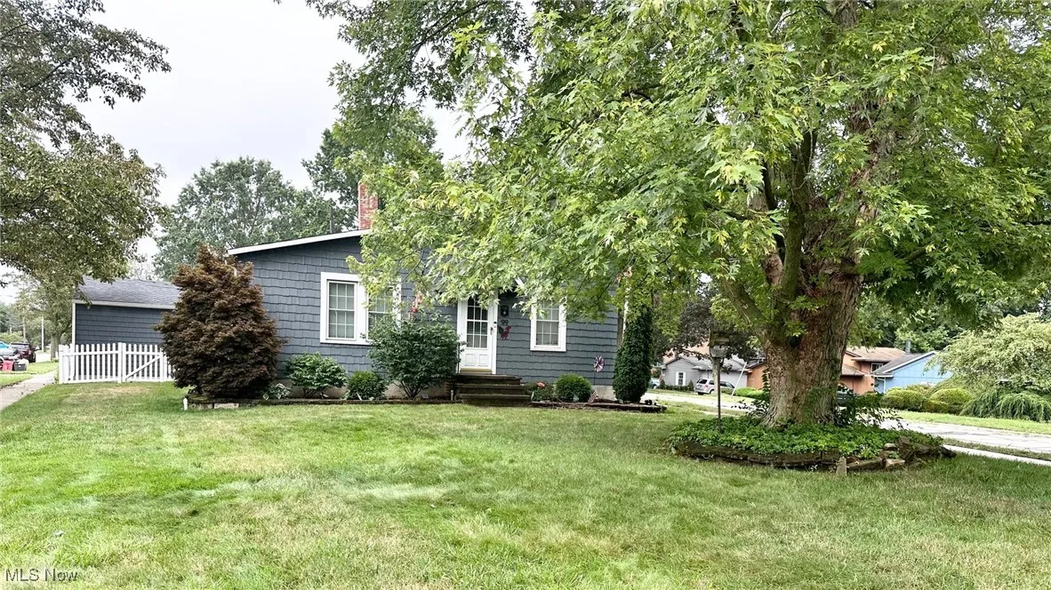 Obstructed view of property featuring a chimney