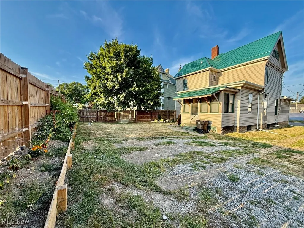 View of fenced backyard