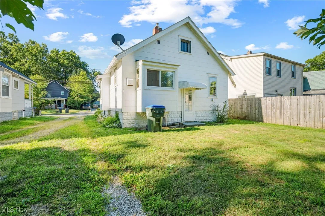 Rear view of property featuring a chimney