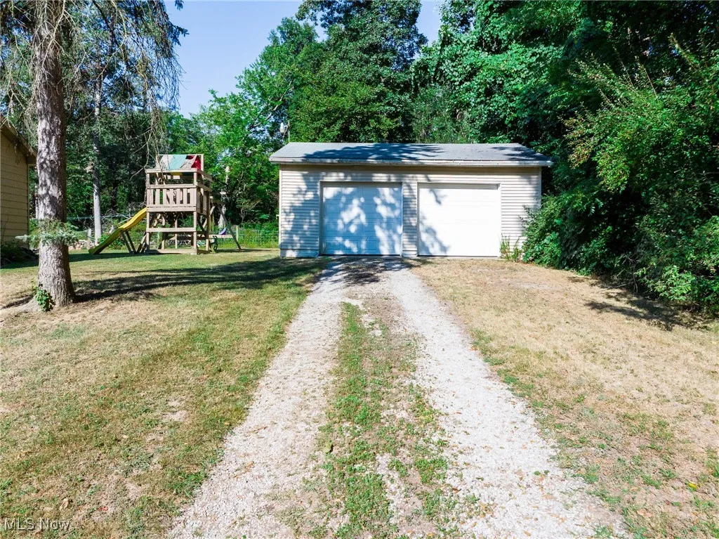 View of outdoor structure with a playground
