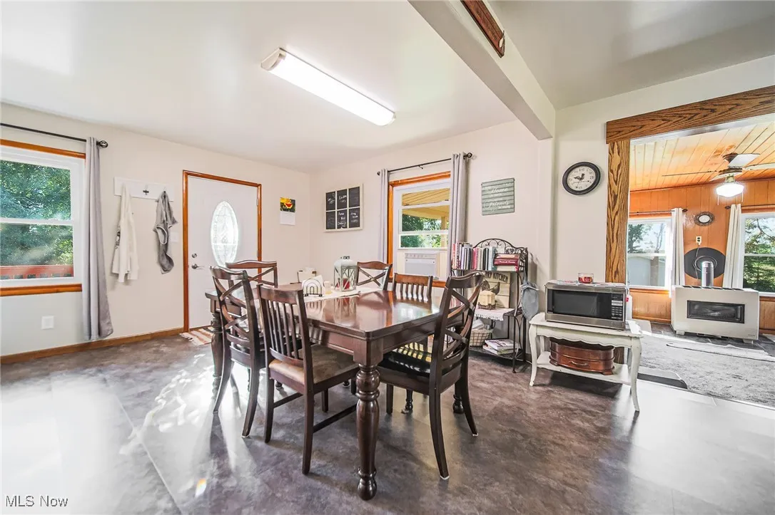 Dining space featuring healthy amount of natural light and a ceiling fan