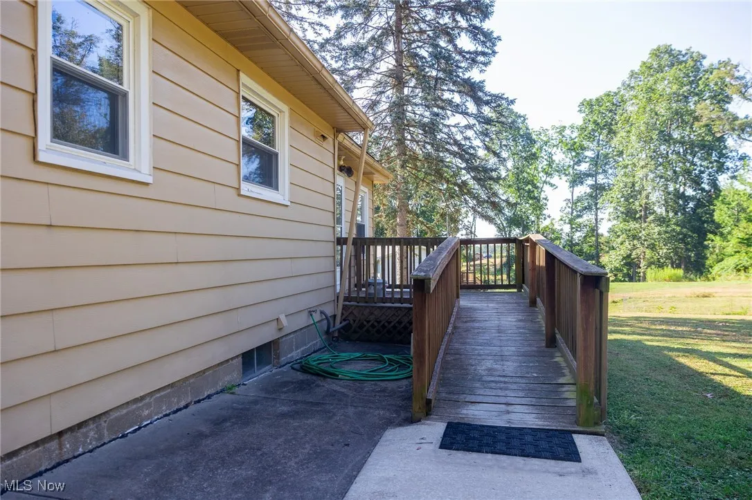 Wooden terrace with a yard