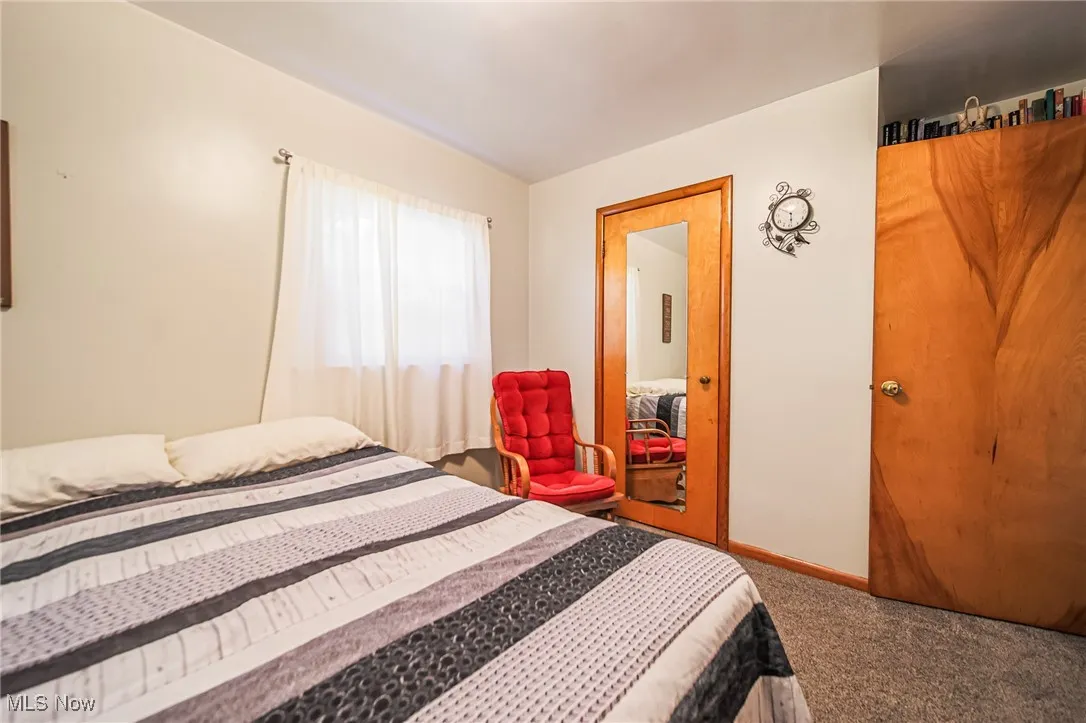 Bedroom with carpet and baseboards