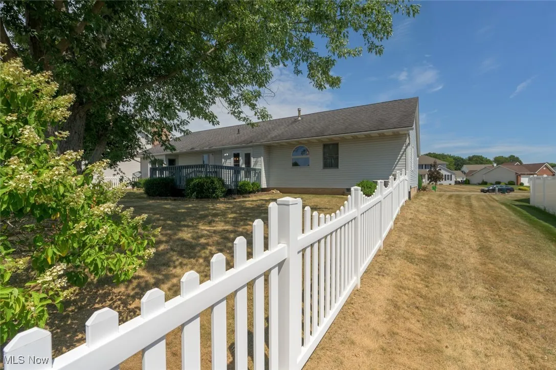 Back of property with a deck