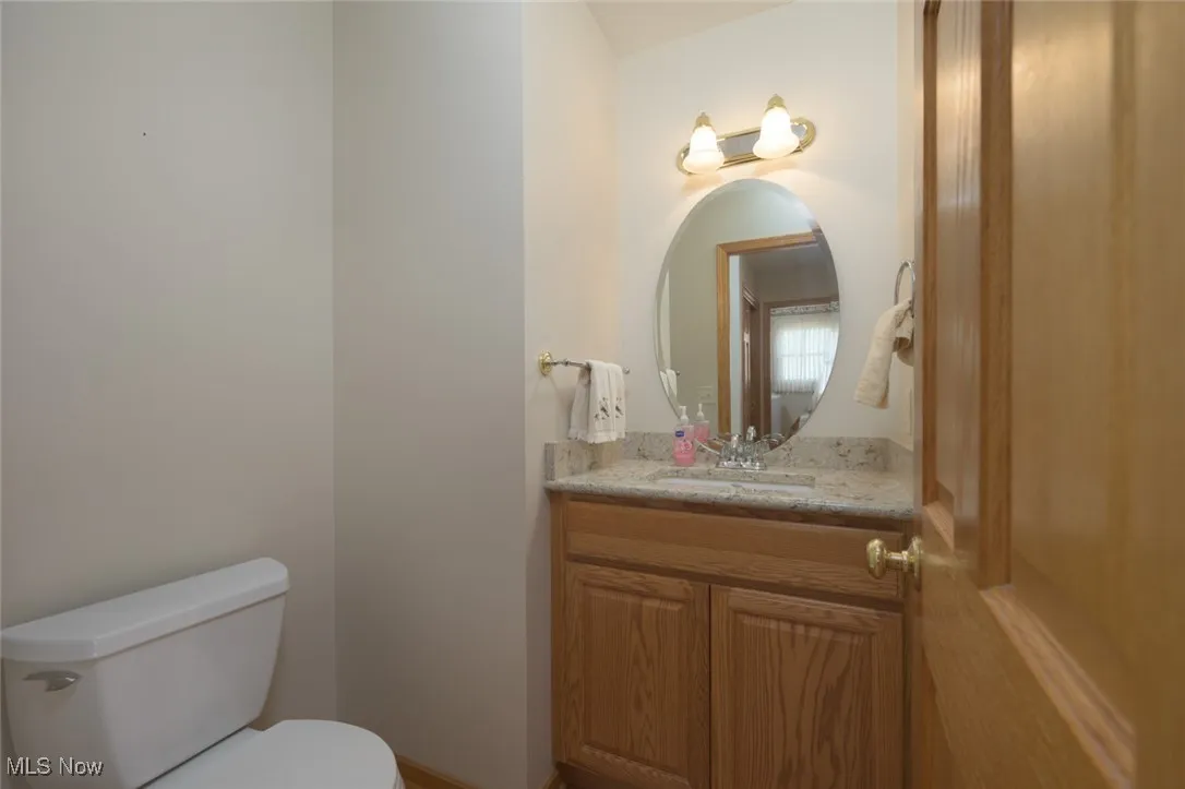 Bathroom featuring vanity and toilet