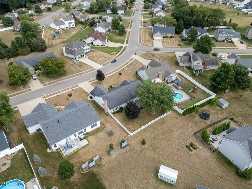 Aerial view of property's location featuring nearby suburban area