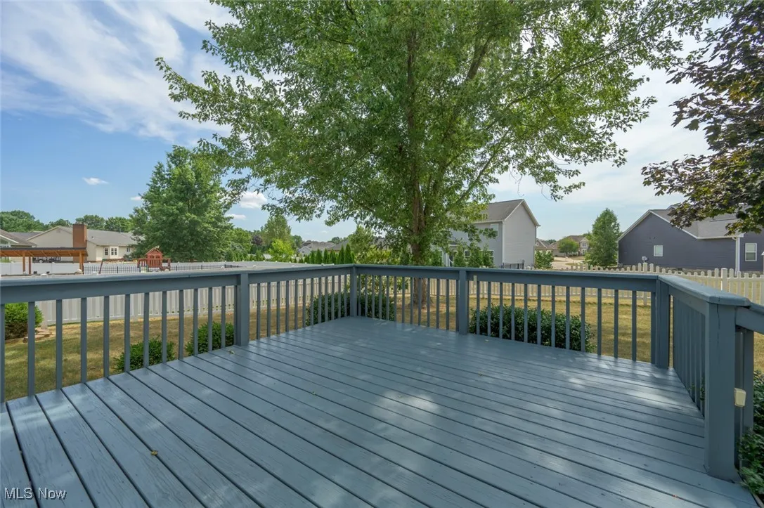 Deck featuring a playground and a residential view