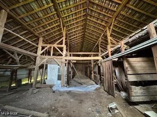 Miscellaneous room with lofted ceiling