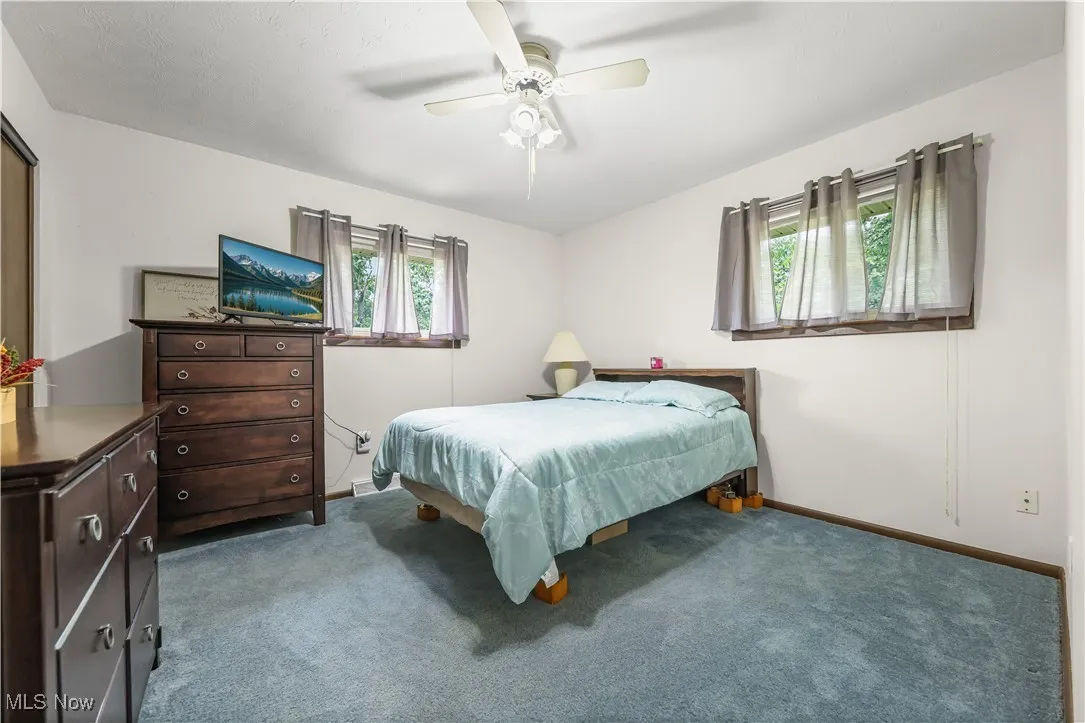 Bedroom featuring carpet flooring and ceiling fan