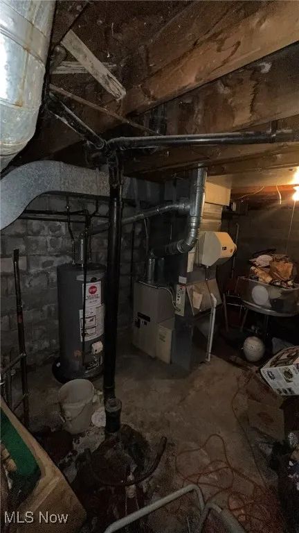 Unfinished basement with gas water heater and heating unit