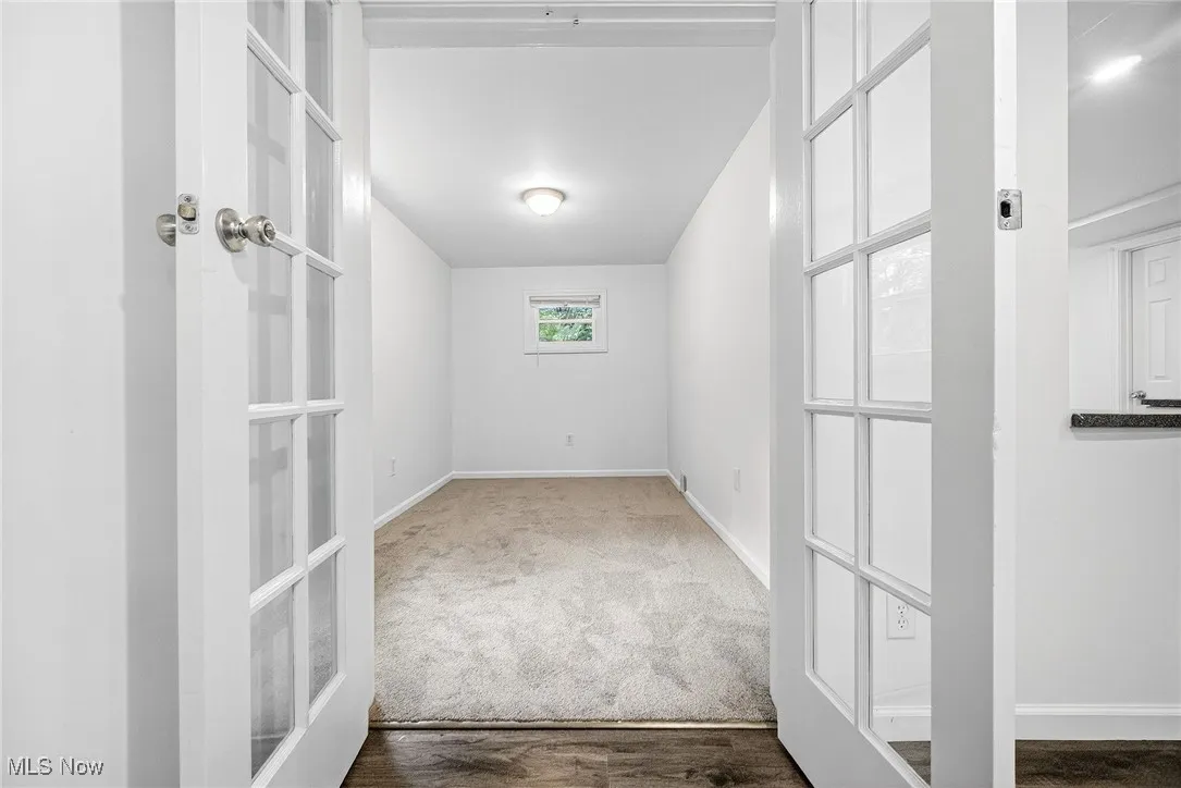 Unfurnished room with baseboards