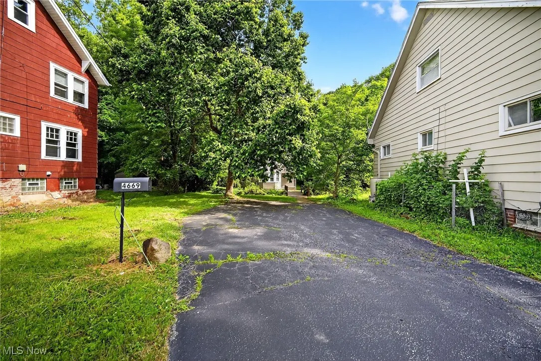 View of home's exterior with a yard