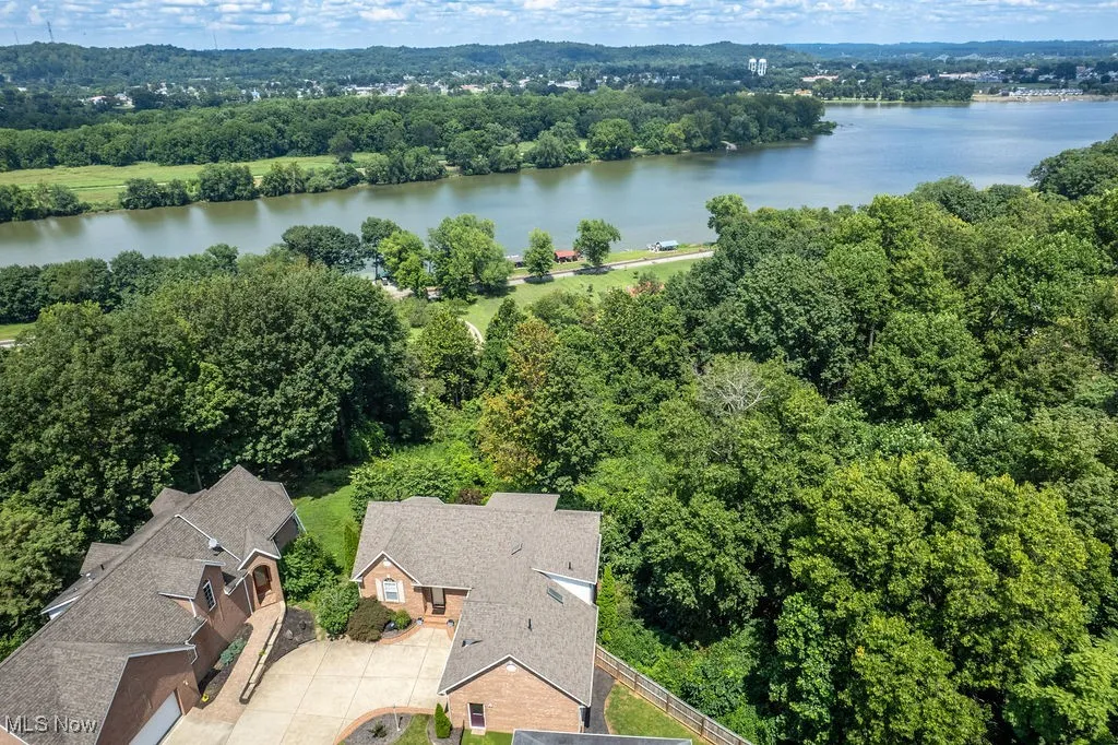 Aerial view of a nearby body of water and a forest