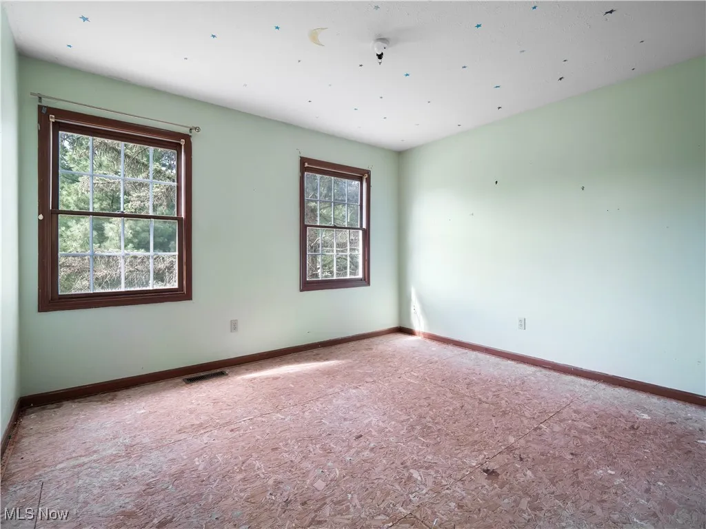 Spare room with baseboards