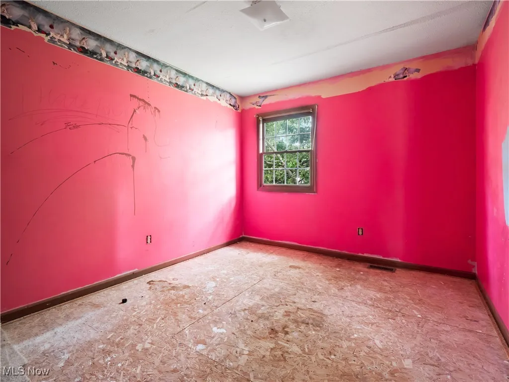 Empty room with baseboards