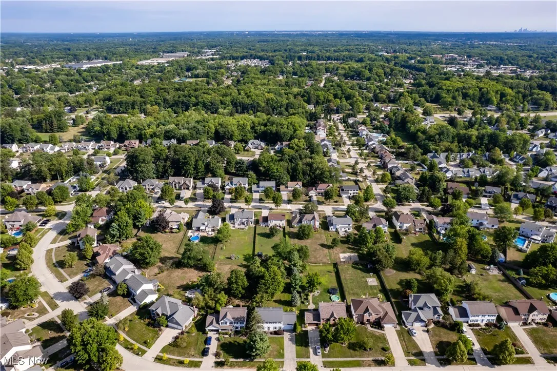 Aerial overview of property's location featuring nearby suburban area